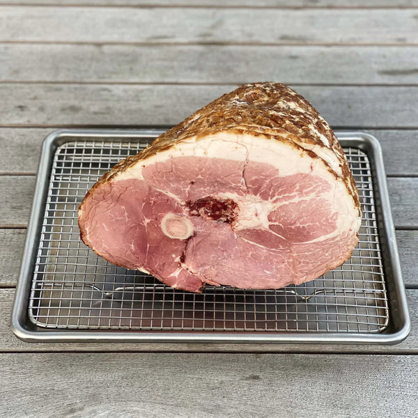 Preparing a Berkwood Farms Ham on the table for a holiday celebration