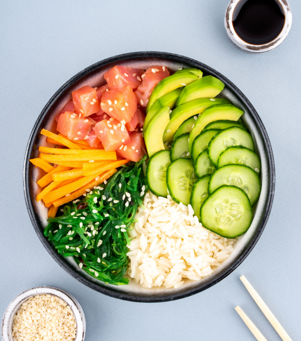 Ready to eat Ora King Salmon poke bowl with soy sauce, sushi rice and fresh veggies