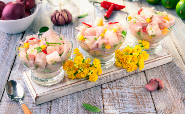 Kampachi Ceviche displayed on glass dishes with mango salsa