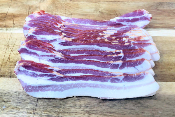 Heritage Bacon on a cutting board