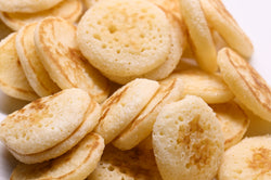 caviar blinis up close in a pile